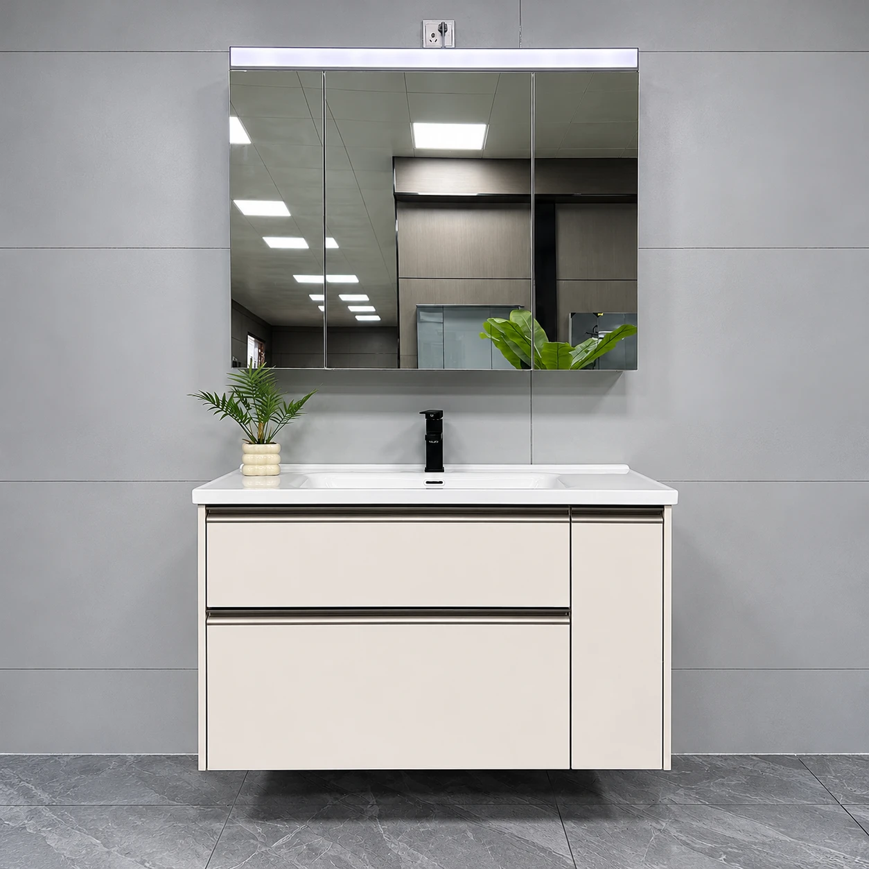 Mueble de baño de dos cajones en color claro con marco metálico