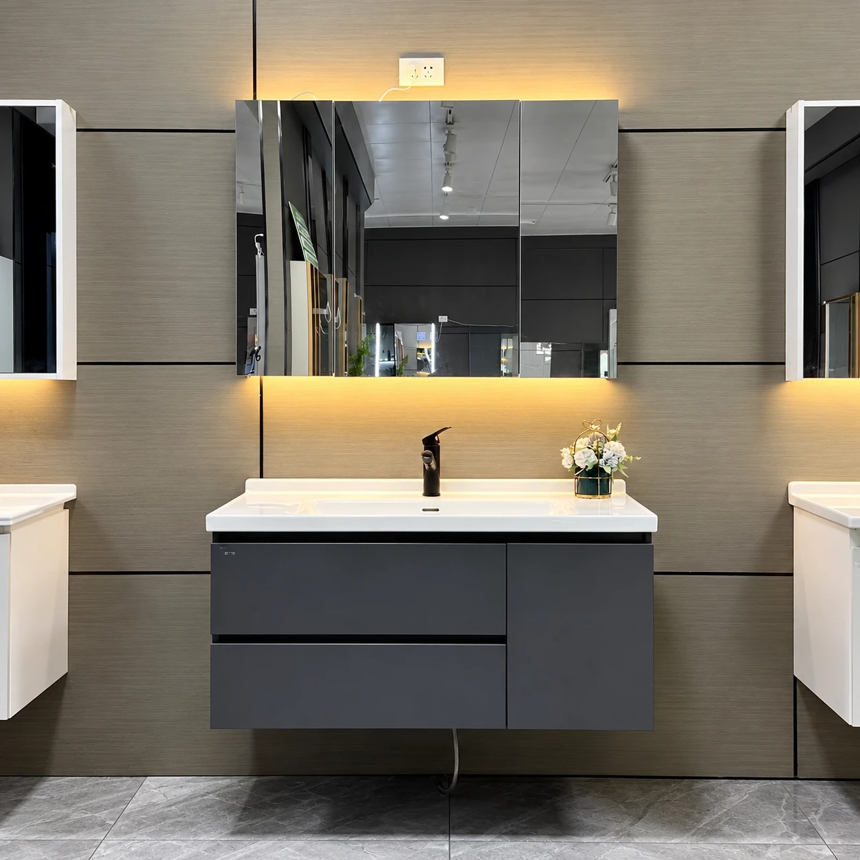 Dark gray bathroom vanity with warm-light mirror cabinet - Bathroom vanity area